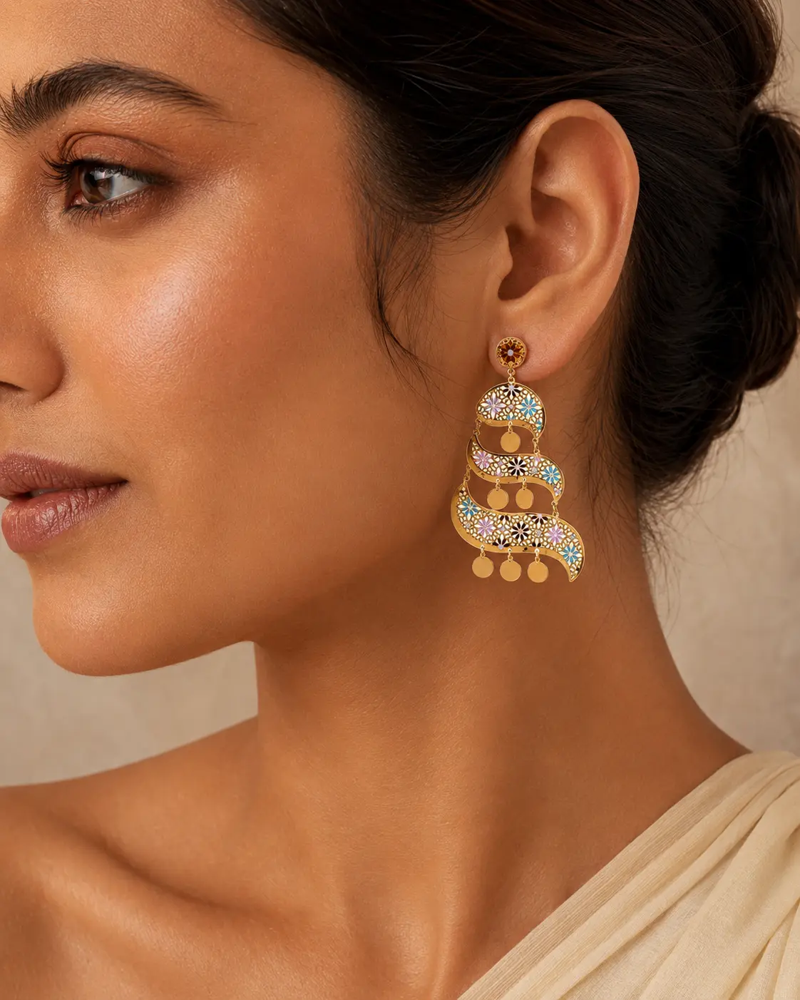 Model wearing sculptural Rajkot gold chandelier earrings