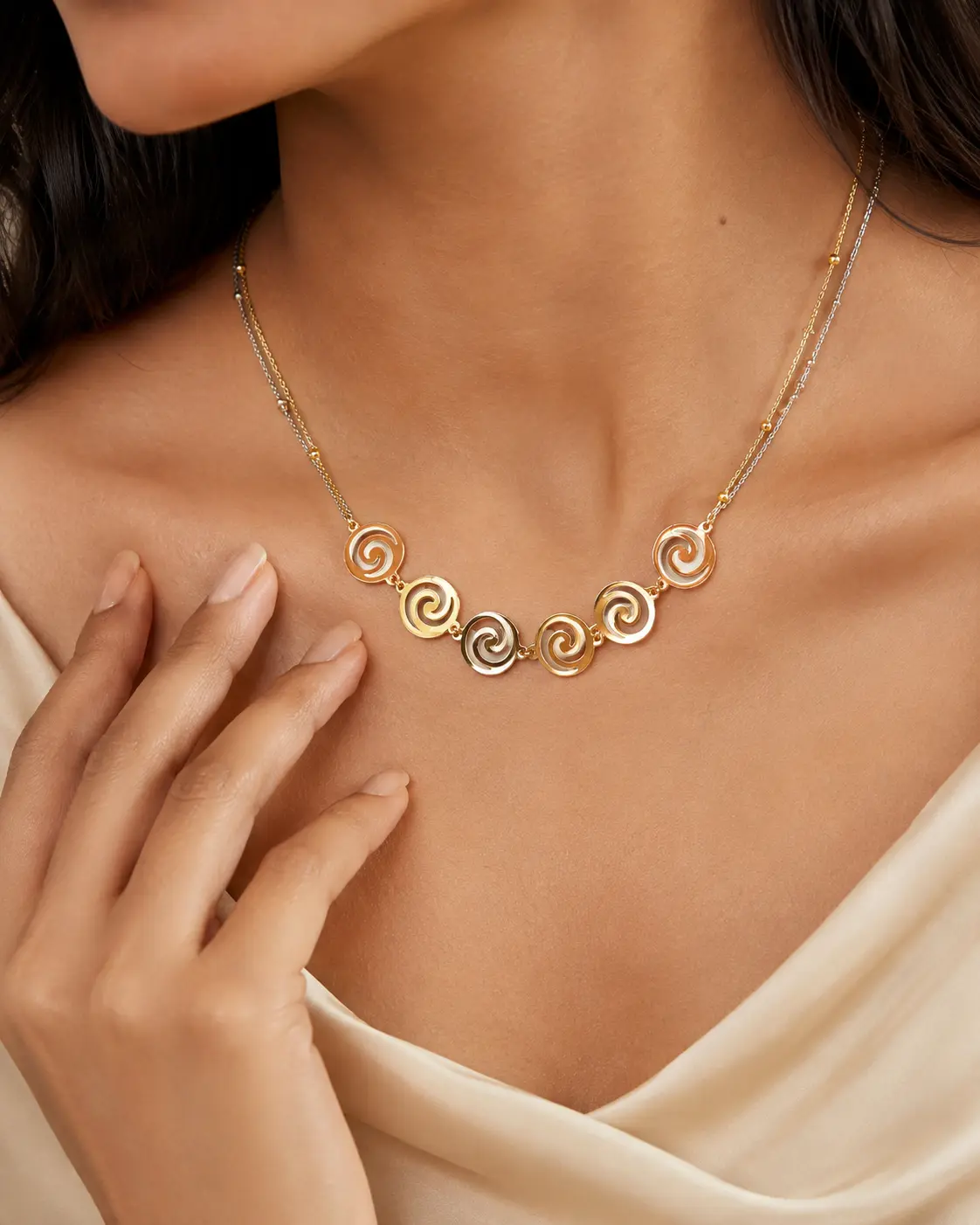Model wearing a precision-crafted multi-tone Zonira necklace